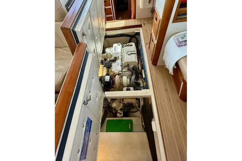 Slide: The Image of Engine compartment of a 2006 Duffy 37 Downeast boat, showcasing interior details. - 58
