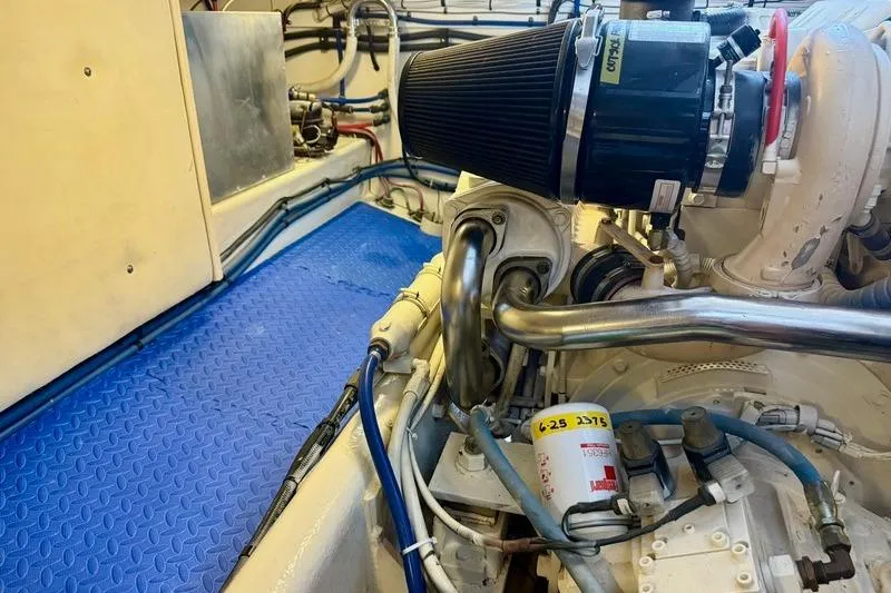 Slide: The Image of Engine room of a 2006 Duffy 37 Downeast boat, featuring mechanical components. - 59