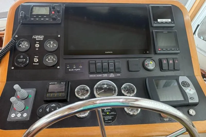 Slide: The Image of Control panel of a 2006 Duffy 37 Downeast boat with navigation instruments. - 63