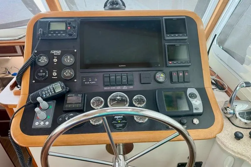 Slide: The Image of Control panel of a 2006 Duffy 37 Downeast boat with navigation instruments. - 64