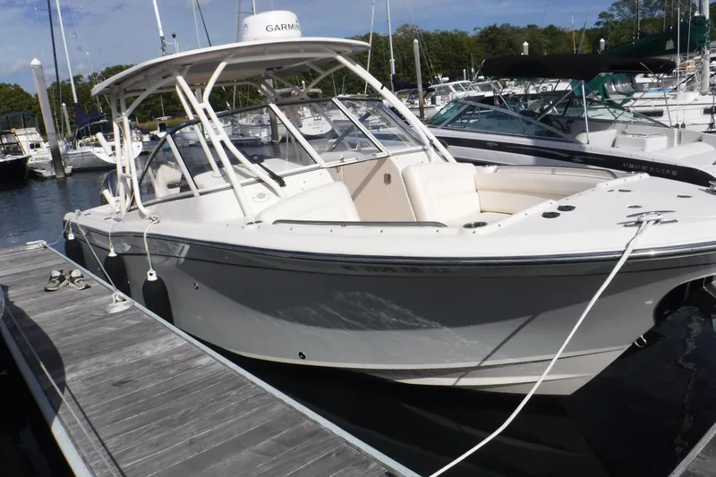 Slide: The Image of 2020 Grady-White Freedom 285 boat docked at marina, featuring sleek design and spacious seating. - 15