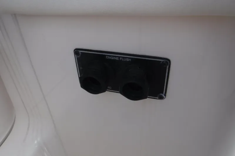 Slide: The Image of 2020 Grady-White Freedom 285 engine flush ports on boat interior. - 17