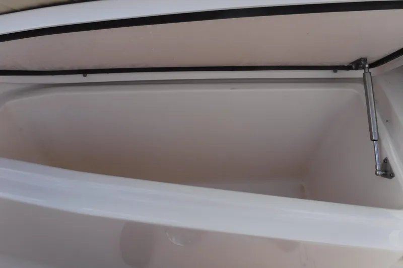Slide: The Image of Open storage compartment in 2020 Grady-White Freedom 285 boat. - 19