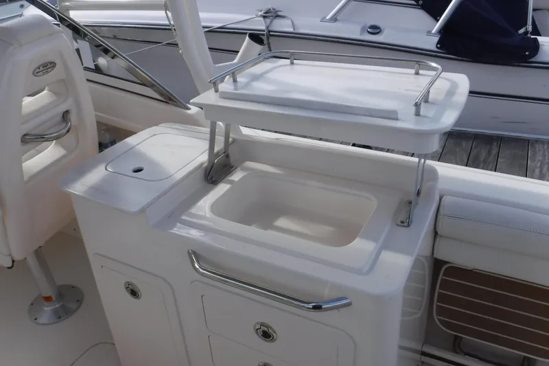 Slide: The Image of 2020 Grady-White Freedom 285 boat interior with sink and storage area. - 23