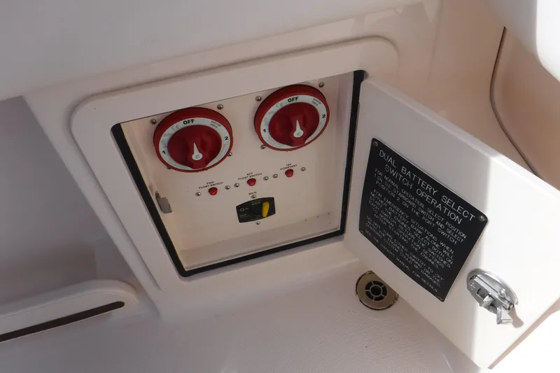 Slide: The Image of 2020 Grady-White Freedom 285 dual battery switch panel with operation instructions. - 24