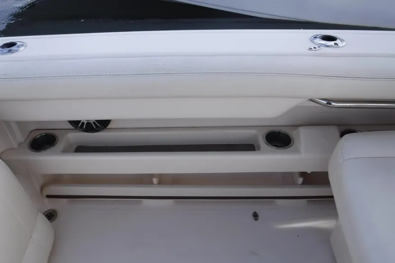 Slide: The Image of 2020 Grady-White Freedom 285 boat interior with cup holders and seating. - 27