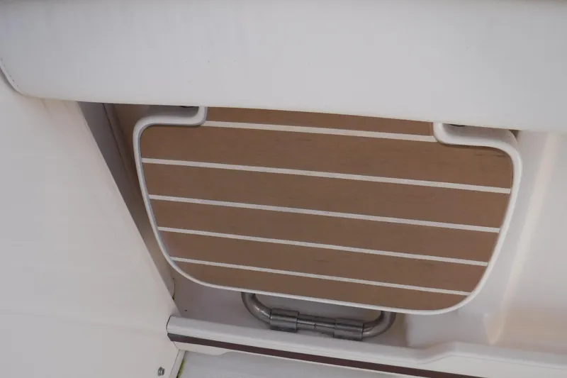 Slide: The Image of 2020 Grady-White Freedom 285 boat swim platform detail with teak finish. - 34
