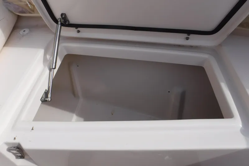 Slide: The Image of Open storage compartment on a 2020 Grady-White Freedom 285 boat. - 35