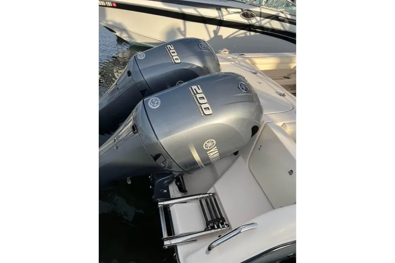Slide: The Image of 2020 Grady-White Freedom 285 boat with twin Yamaha 200 engines at dock. - 9