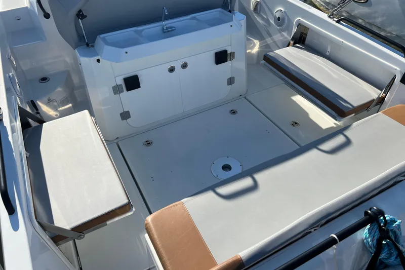 Slide: The Image of 2022 Beneteau Flyer 8 SUNdeck interior with seating and storage compartments. - 10