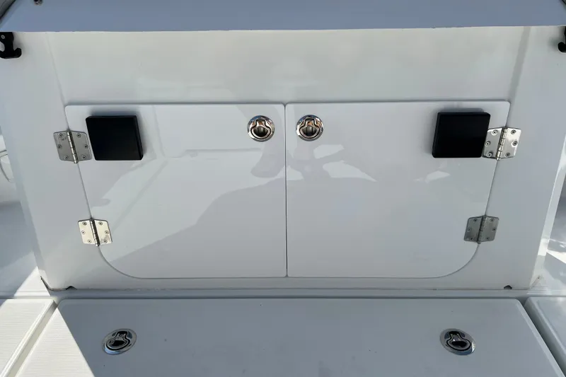 Slide: The Image of 2022 Beneteau Flyer 8 SUNdeck storage compartment with sleek white finish and secure latches. - 11