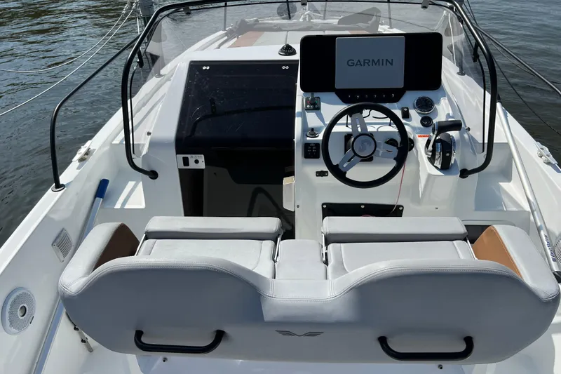Slide: The Image of 2022 Beneteau Flyer 8 SUNdeck cockpit with Garmin navigation system and dual seating. - 2