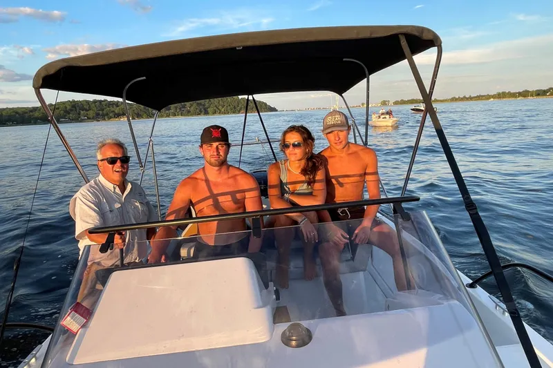 Slide: The Image of Four people enjoying a ride on a 2022 Beneteau Flyer 8 SUNdeck boat. - 21