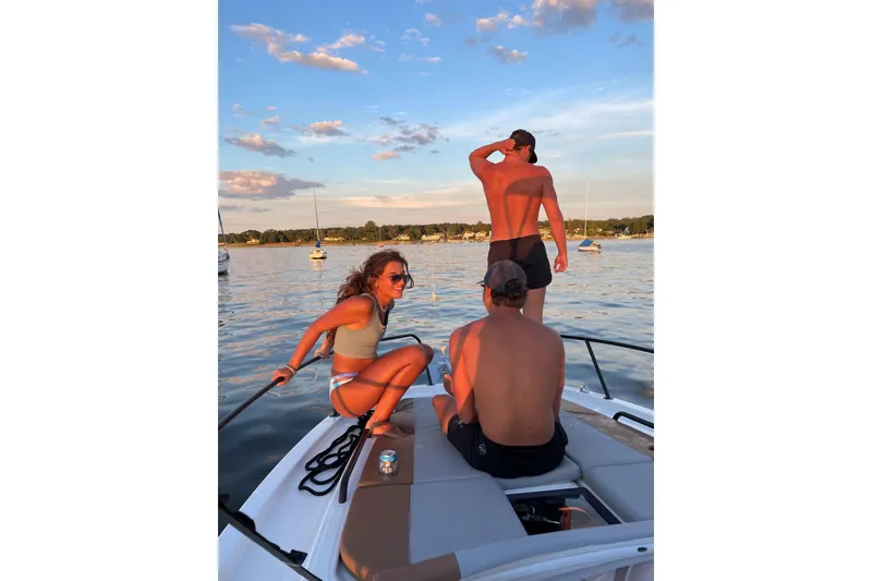 Slide: The Image of People enjoying sunset on a 2022 Beneteau Flyer 8 SUNdeck boat. - 4