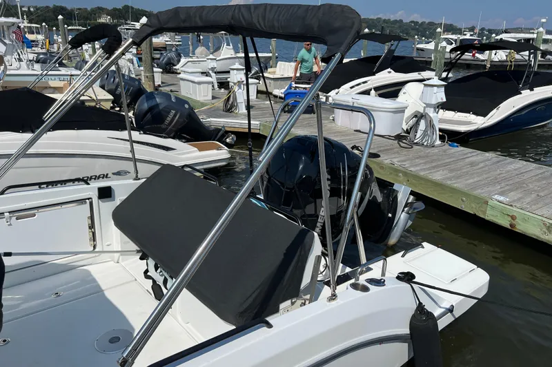 Slide: The Image of 2022 Beneteau Flyer 8 SUNdeck docked at marina with other boats. - 6