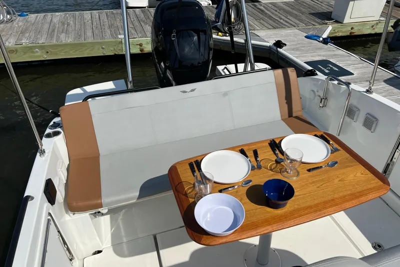 Slide: The Image of 2022 Beneteau Flyer 8 SUNdeck with set dining table, docked at marina. - 8