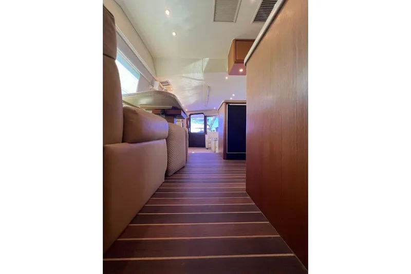 Slide: The Image of Interior view of 2002 Ocean Yachts 56 Super Sport, featuring elegant wood flooring and modern design. - 10