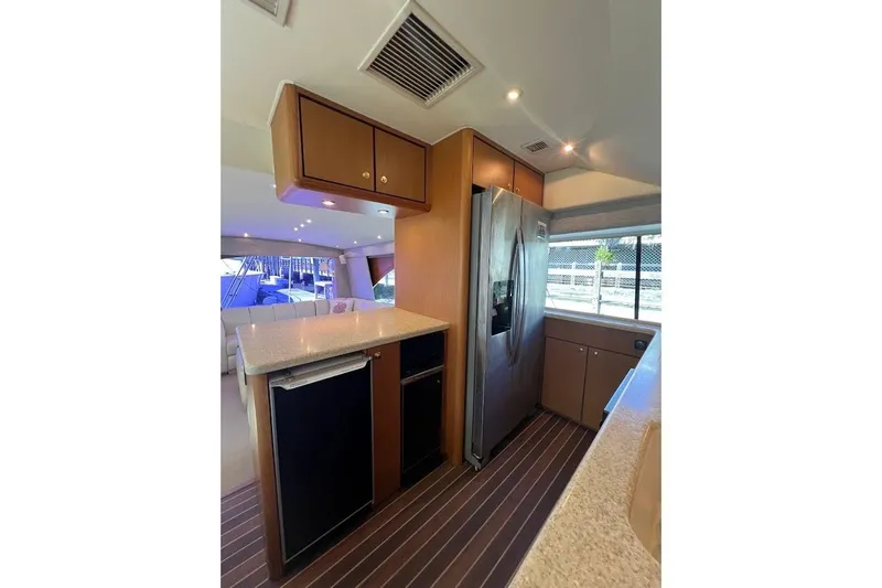 Slide: The Image of Luxurious kitchen interior of 2002 Ocean Yachts 56 Super Sport with modern appliances. - 12