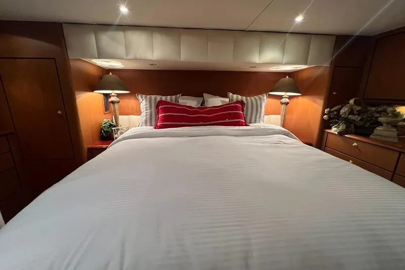 Slide: The Image of Luxurious bedroom interior of 2002 Ocean Yachts 56 Super Sport with elegant lighting and decor. - 14
