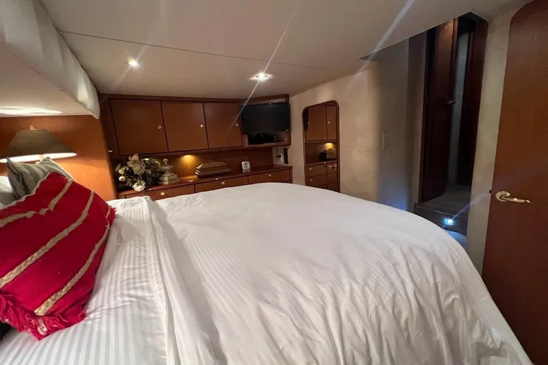 Slide: The Image of Luxurious bedroom interior of 2002 Ocean Yachts 56 Super Sport with elegant decor and lighting. - 17