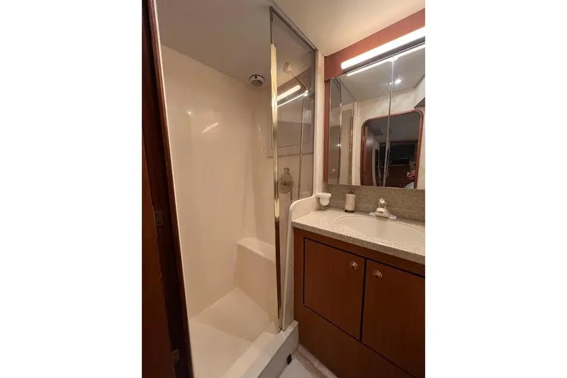 Slide: The Image of Bathroom interior of 2002 Ocean Yachts 56 Super Sport with shower and vanity. - 18