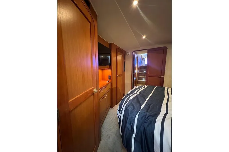 Slide: The Image of Luxurious cabin interior of 2002 Ocean Yachts 56 Super Sport with wood finishes. - 21
