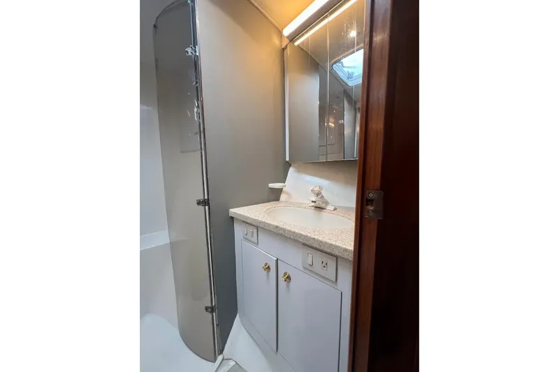 Slide: The Image of Bathroom interior of 2002 Ocean Yachts 56 Super Sport with shower and vanity. - 25