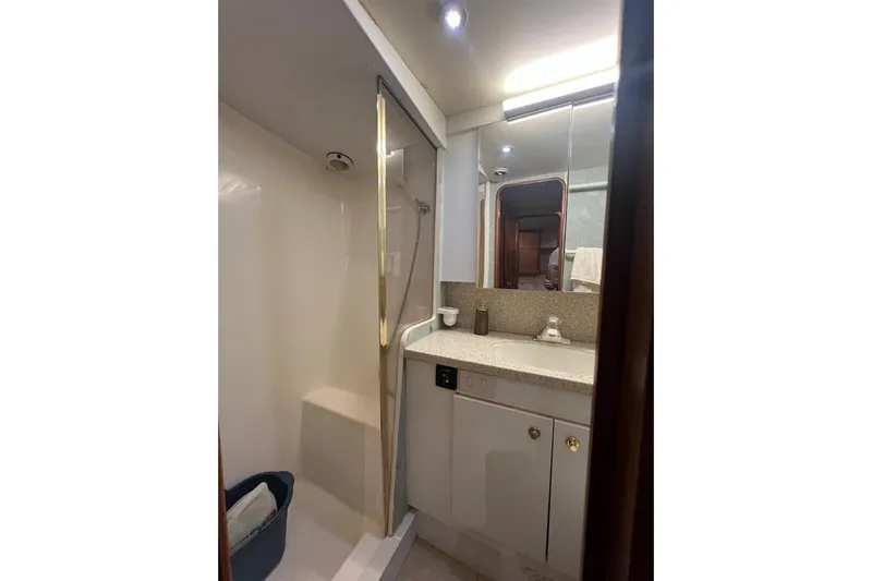 Slide: The Image of Bathroom interior of 2002 Ocean Yachts 56 Super Sport, featuring shower and vanity. - 29