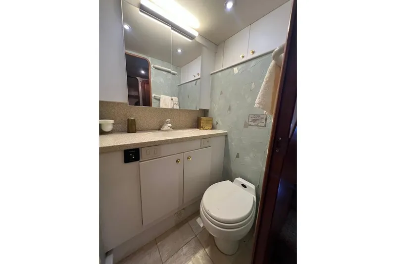 Slide: The Image of Bathroom interior of 2002 Ocean Yachts 56 Super Sport with modern fixtures. - 30