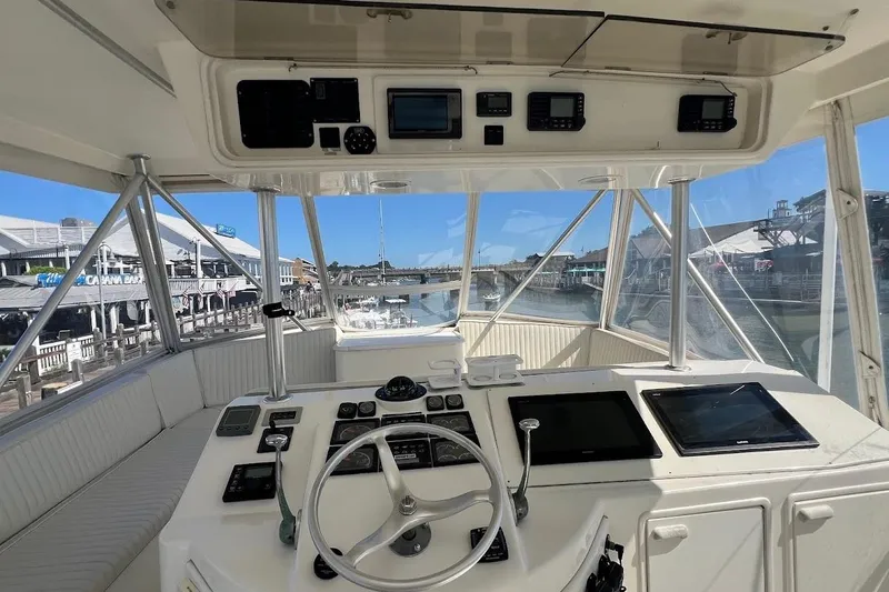 Slide: The Image of Cockpit view of 2002 Ocean Yachts 56 Super Sport, featuring navigation instruments and steering wheel. - 35