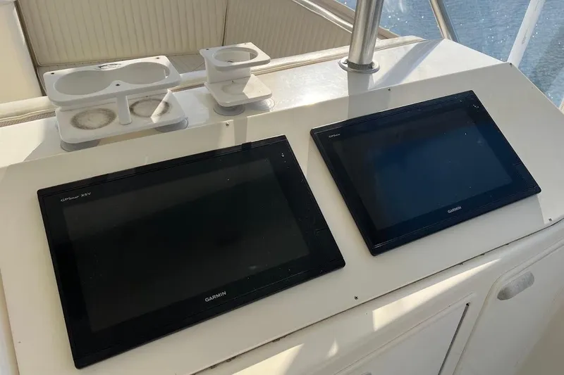 Slide: The Image of Control panel of a 2002 Ocean Yachts 56 Super Sport with various navigation instruments. - 40