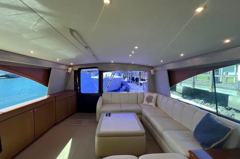 Slide: The Image of Luxurious interior of 2002 Ocean Yachts 56 Super Sport with plush seating and waterfront view. - 6