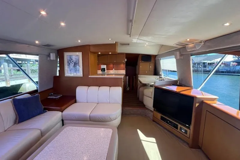 Slide: The Image of Luxurious interior of a 2002 Ocean Yachts 56 Super Sport with elegant seating and modern amenities. - 7