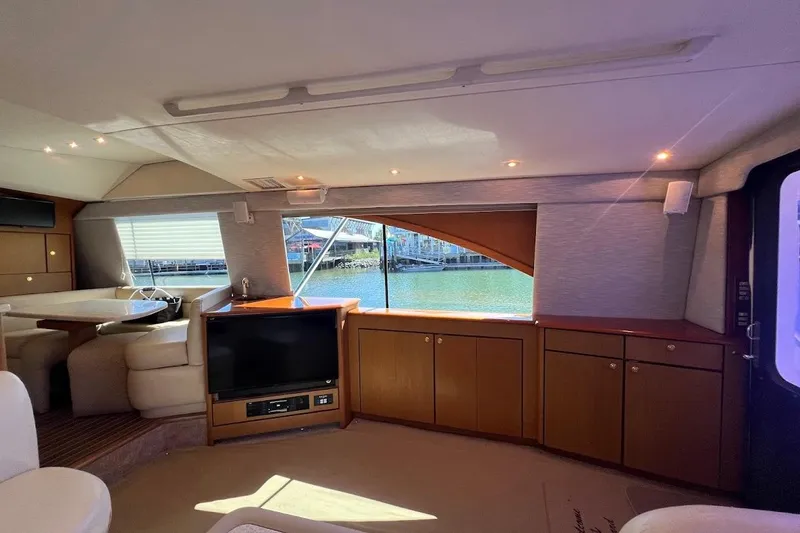 Slide: The Image of Interior of 2002 Ocean Yachts 56 Super Sport with elegant wood cabinetry and waterfront view. - 8