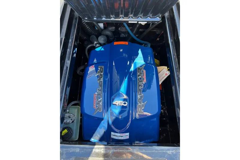 Slide: The Image of 2022 Moomba Makai engine compartment featuring a blue Indmar Raptor 450 engine. - 14