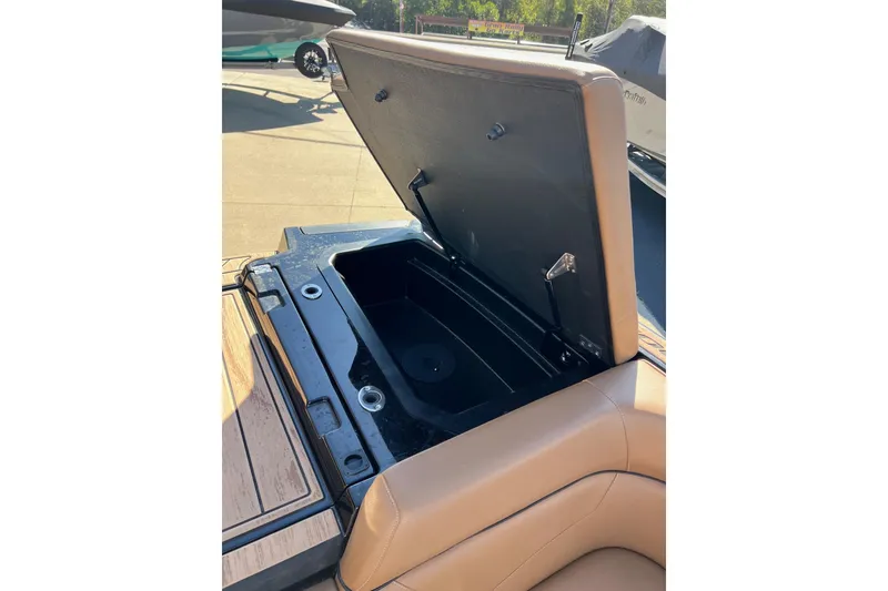 Slide: The Image of 2022 Moomba Makai boat storage compartment open, showcasing interior space. - 15