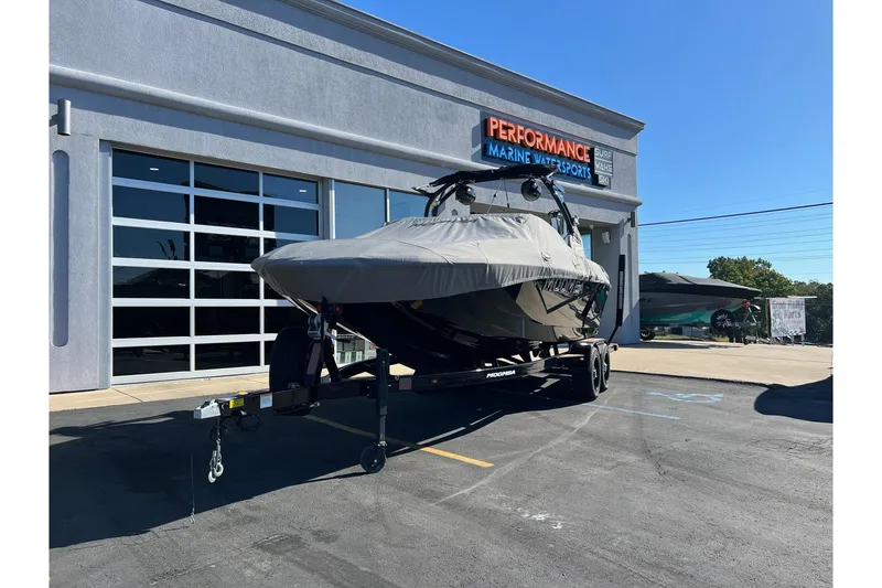 Slide: The Image of 2022 Moomba Makai boat covered on trailer at Performance Marine Watersports. - 18