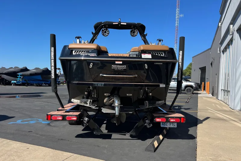 Slide: The Image of 2022 Moomba Makai boat on trailer, rear view, parked outdoors. - 3