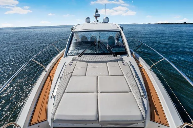 Slide: The Image of 2026 Jeanneau DB 43 yacht with spacious deck, cruising on calm blue waters. - 9