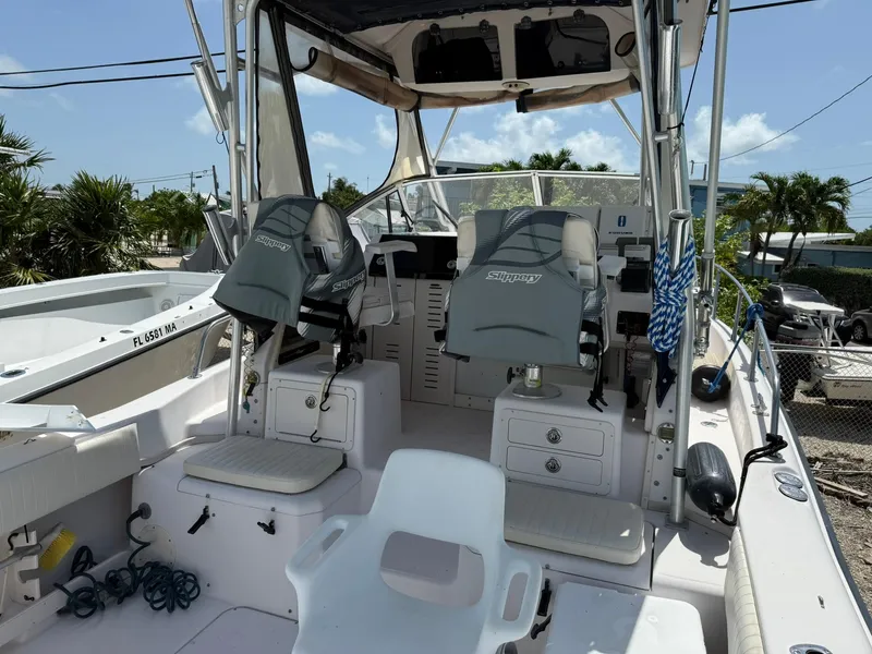Slide: The Image of 2003 Grady-White Sailfish 282 boat interior with seating and control panel. - 11