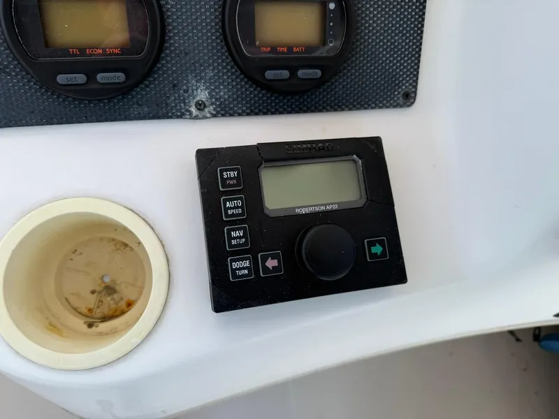 Slide: The Image of Control panel of a 2003 Grady-White Sailfish 282 boat with navigation instruments. - 9