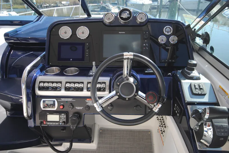 Slide: The Image of 2017 Formula 370 Super Sport boat interior with luxurious seating and modern dashboard. - 6