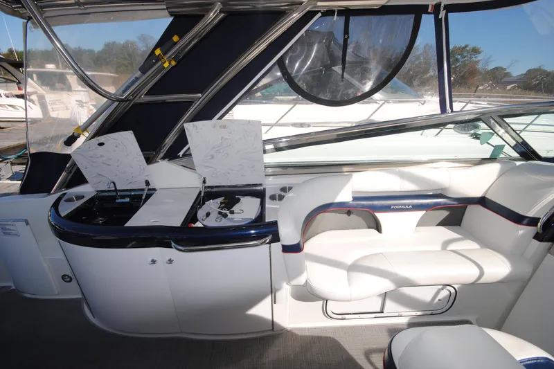 Slide: The Image of 2017 Formula 370 Super Sport boat interior with luxurious seating and modern dashboard. - 9