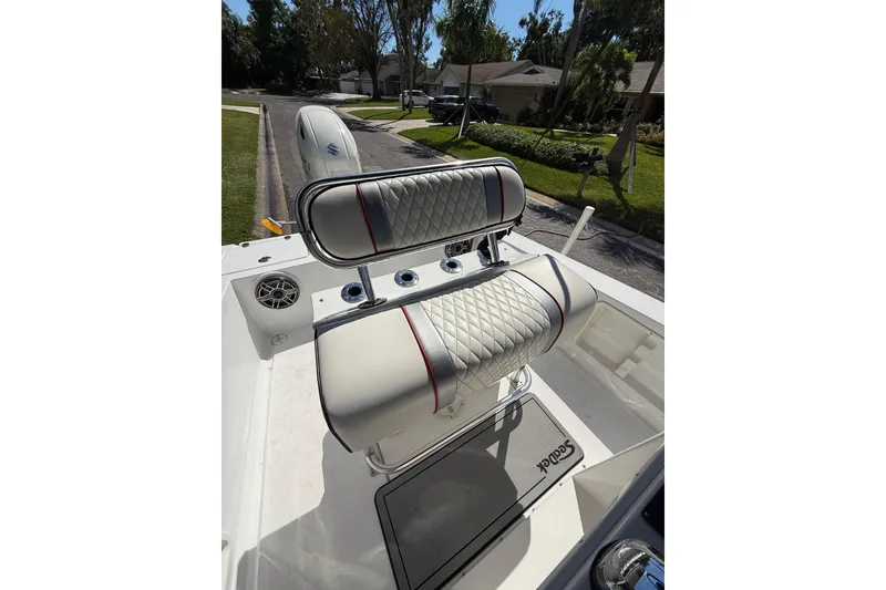 Slide: The Image of Luxurious seating on a 2002 Spectre 22CC boat, featuring diamond-stitched upholstery. - 10