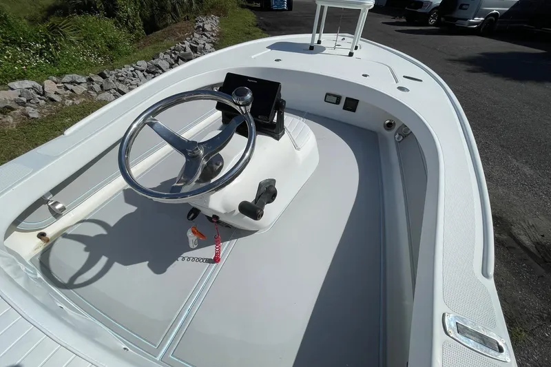 Slide: The Image of 2006 Chaos 16 Bonefish boat interior with steering wheel and control panel. - 11