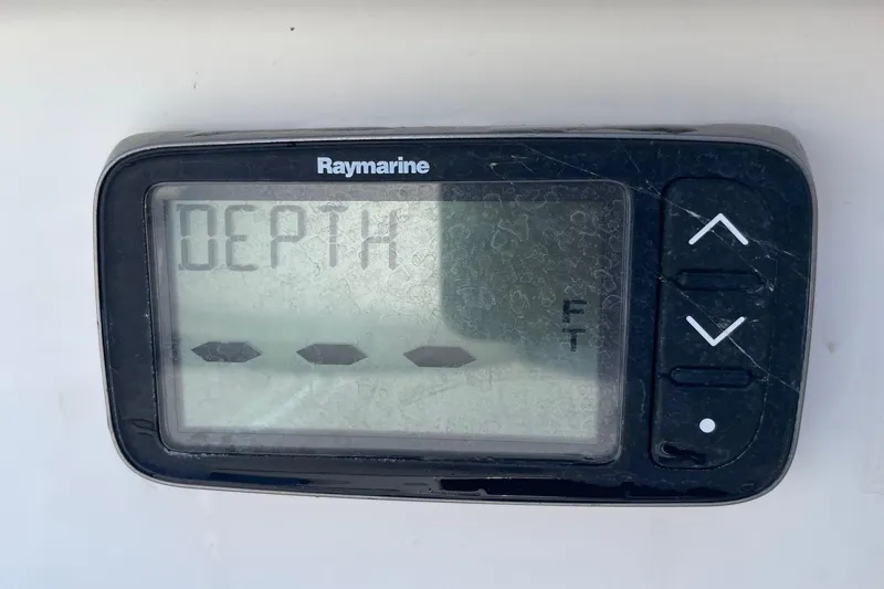 Slide: The Image of Raymarine depth gauge on 2006 Chaos 16 Bonefish boat, displaying depth in feet. - 18