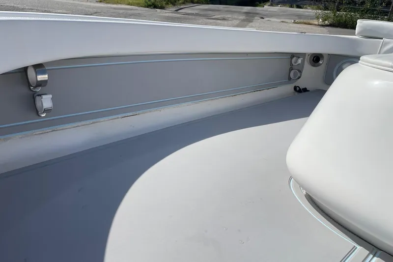 Slide: The Image of 2006 Chaos 16 Bonefish boat interior with sleek white and gray design. - 19