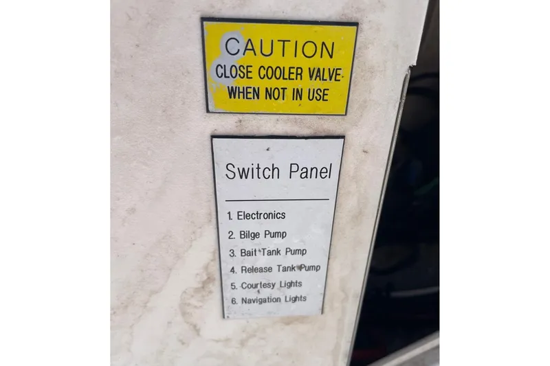 Slide: The Image of Caution and switch panel labels on 2006 Chaos 16 Bonefish boat. - 25