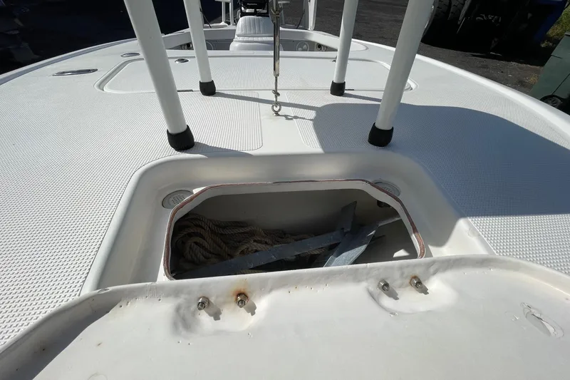 Slide: The Image of 2006 Chaos 16 Bonefish boat deck with anchor storage compartment open. - 26