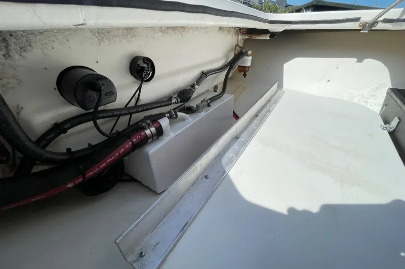 Slide: The Image of Interior view of a 2006 Chaos 16 Bonefish boat showing wiring and components. - 31